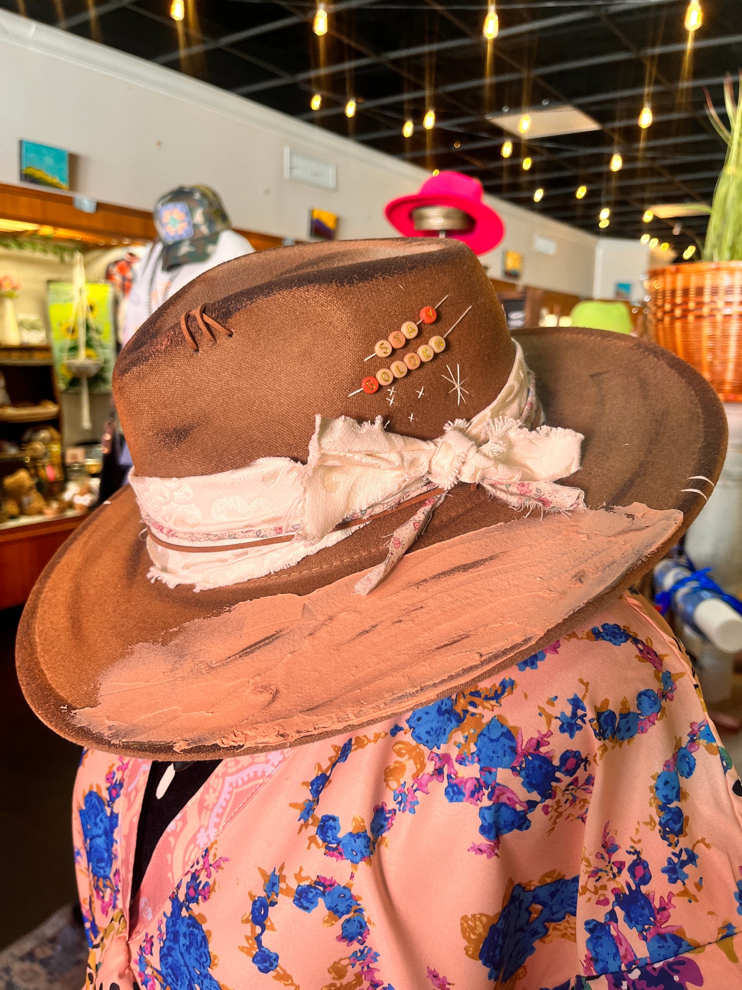 Handmade Bourbon Grae hat with creative leather and gemstone accents
