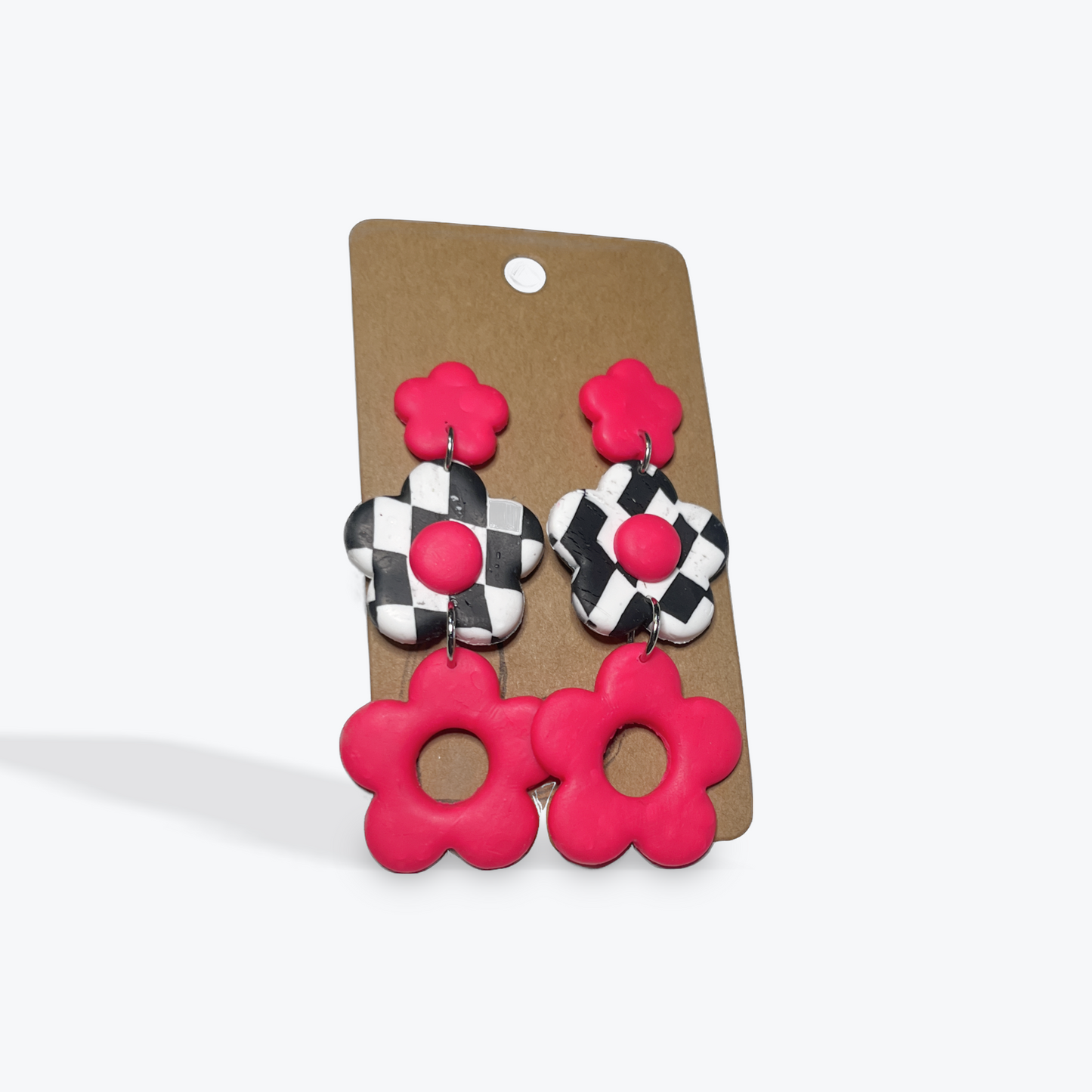 Handmade clay earrings by Earbobs featuring colorful design