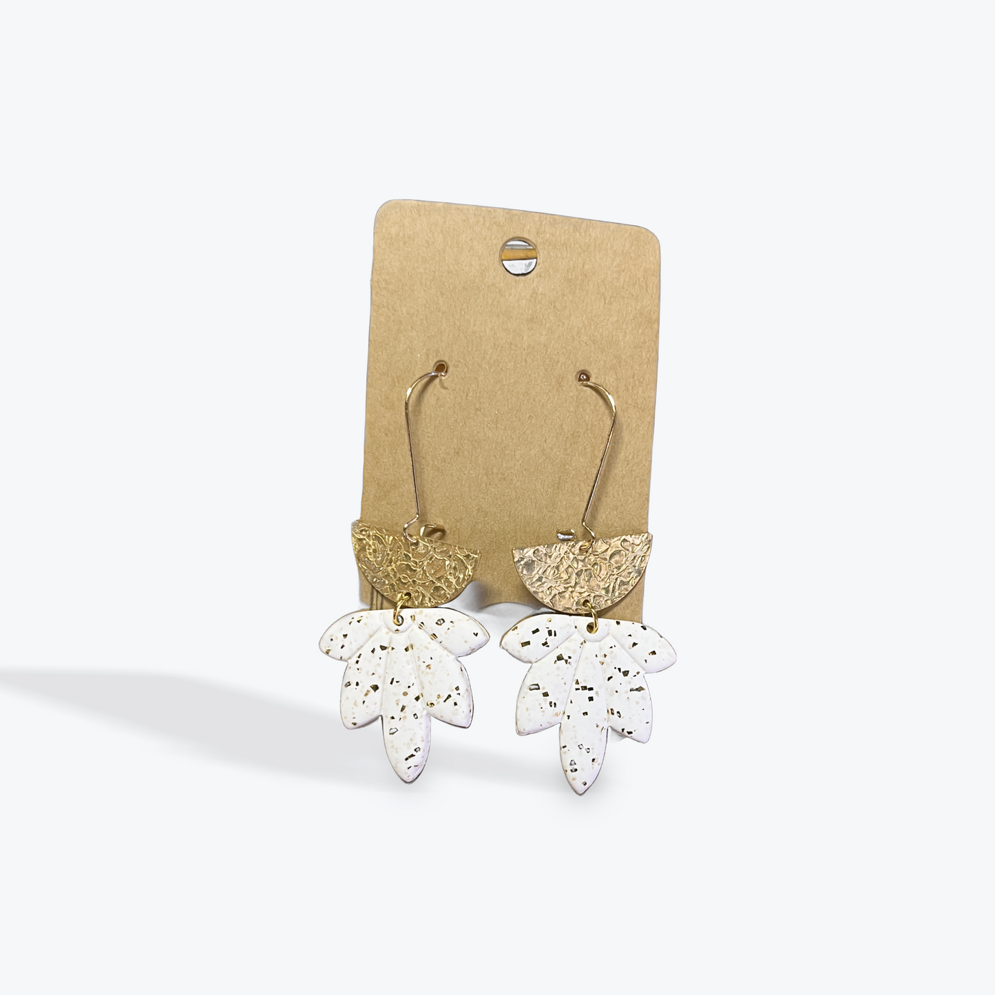 Handmade neutral clay earrings with creative artisan design