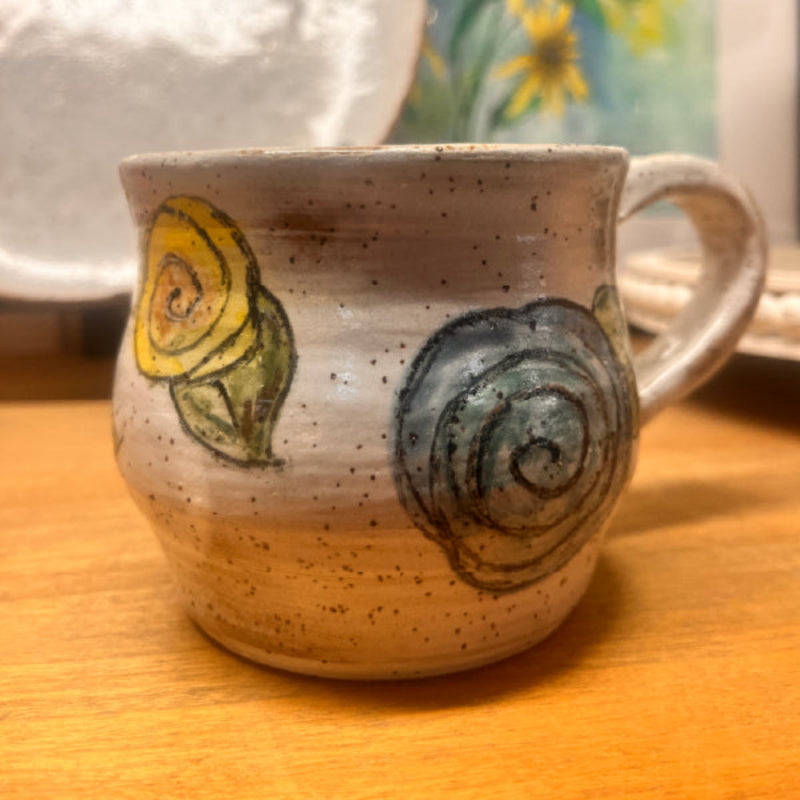 Handmade ceramic mug with hand-painted floral swirl design – artisan drinkware and home décor gift from Emporium 23.