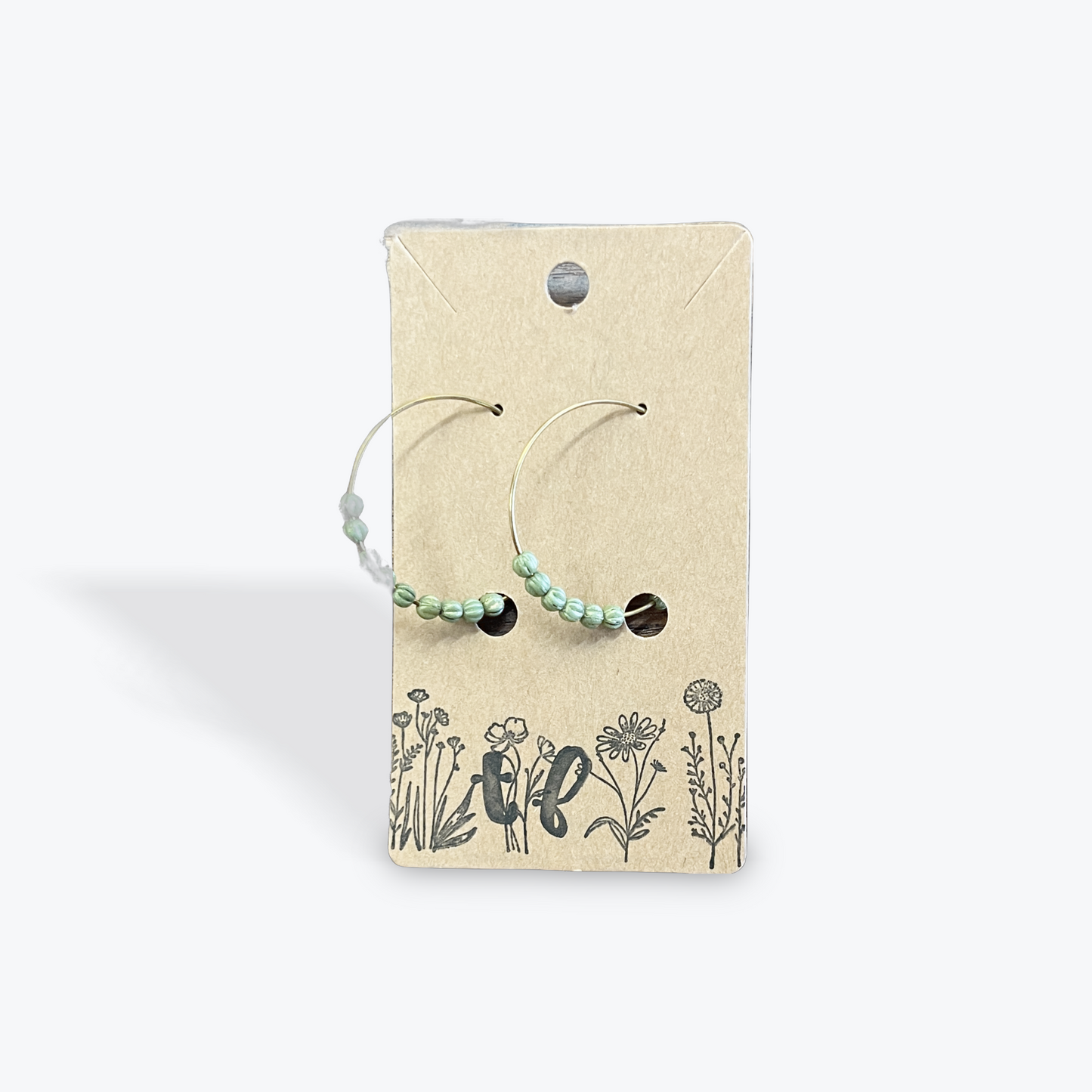 Elegant handmade earrings with gemstone detail artisan crafted