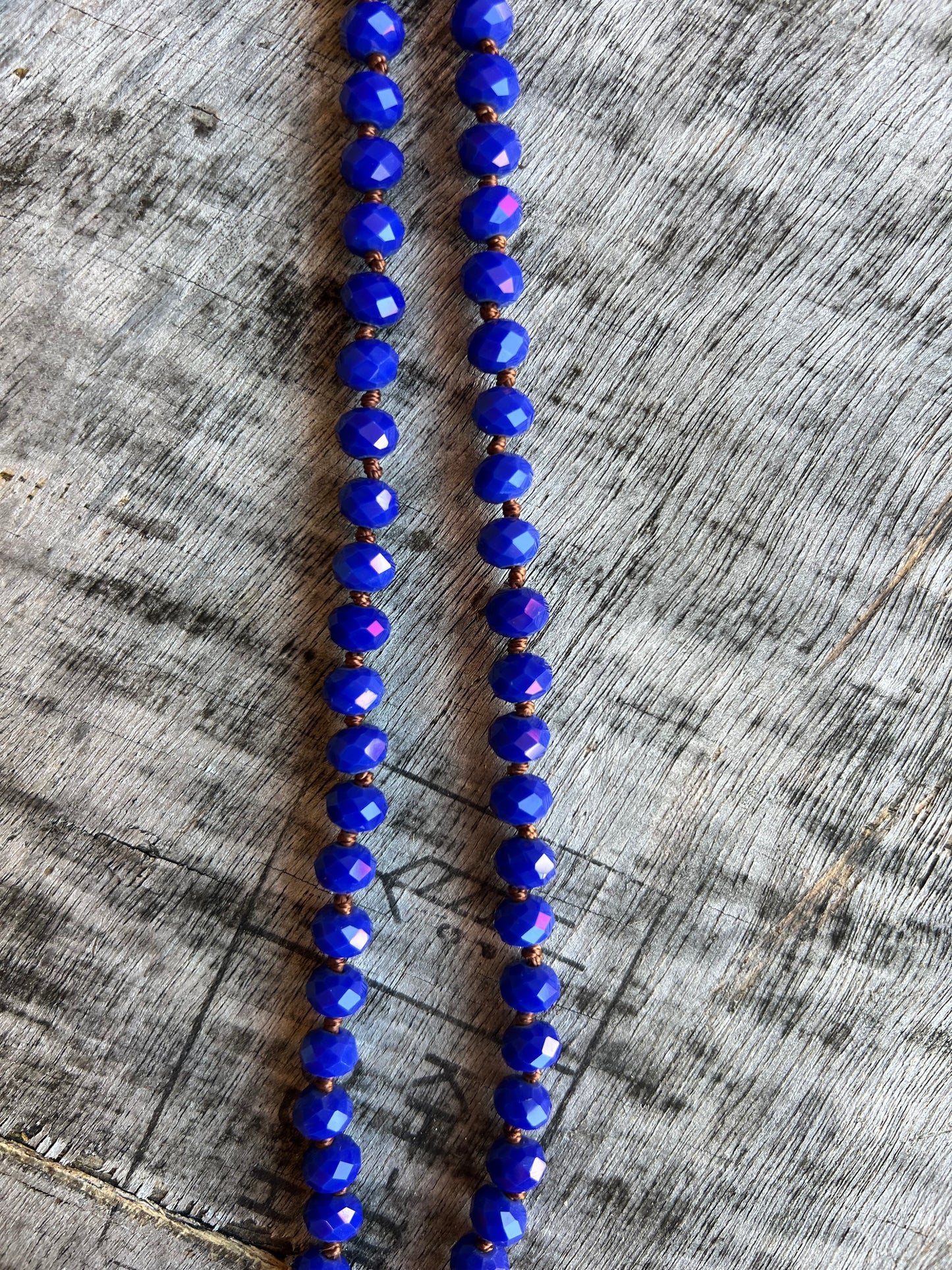 Blue plastic bead rope necklace for layering