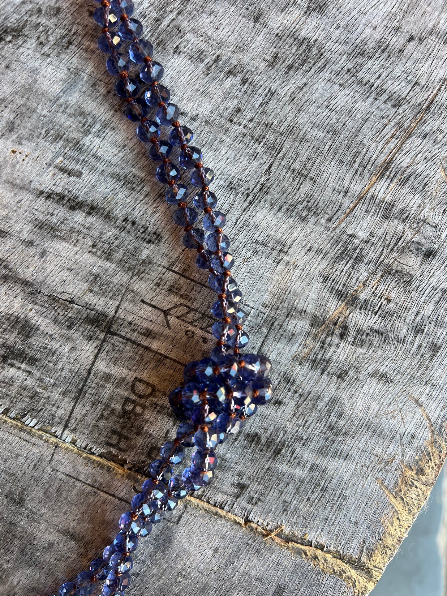 Purple beaded rope necklace with handmade design