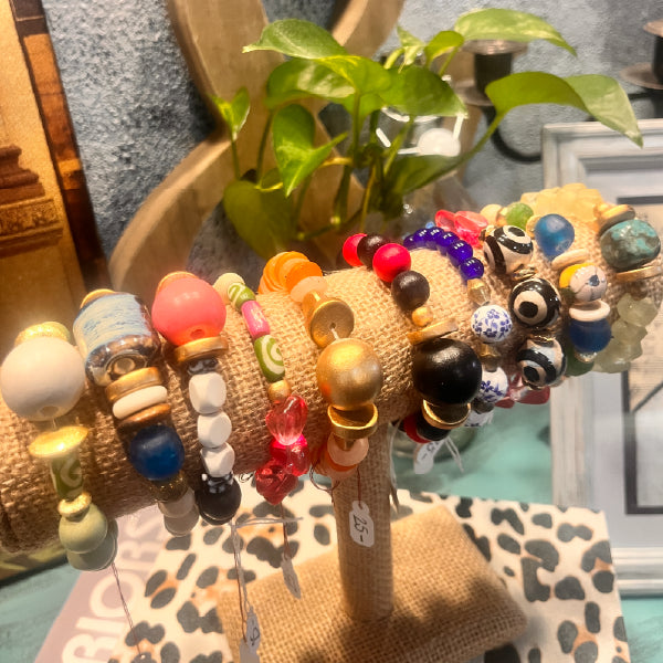 Display of handmade artisan bracelets with colorful beads and unique designs – boutique jewelry from Emporium 23