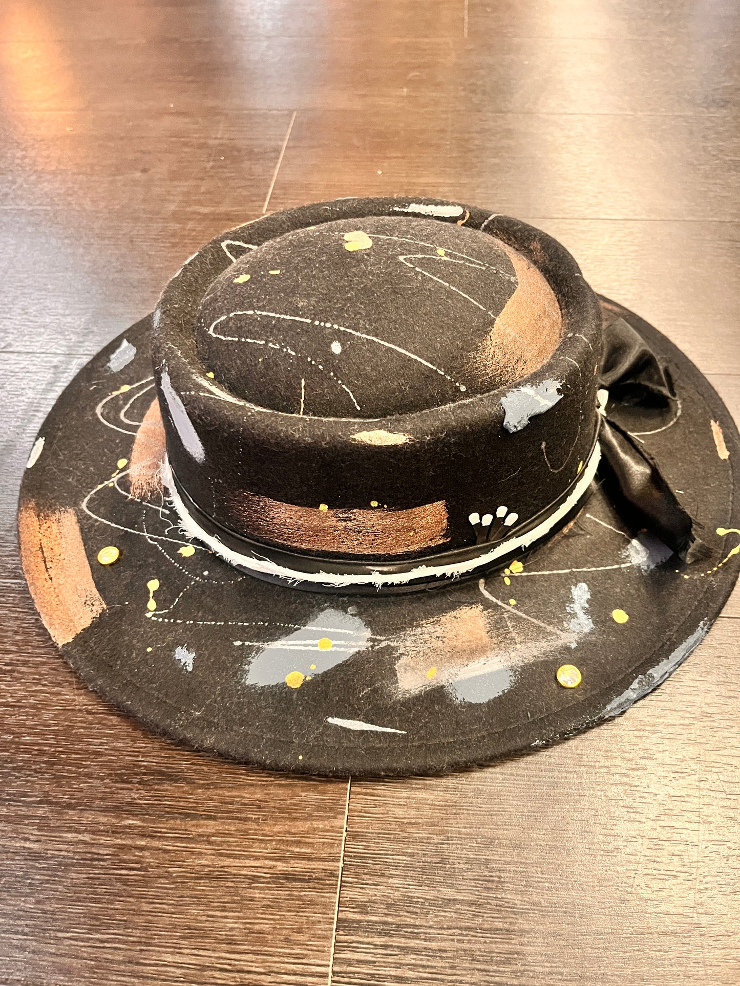 Artisan fashion hat by Bourbon Grae with feathers and charms