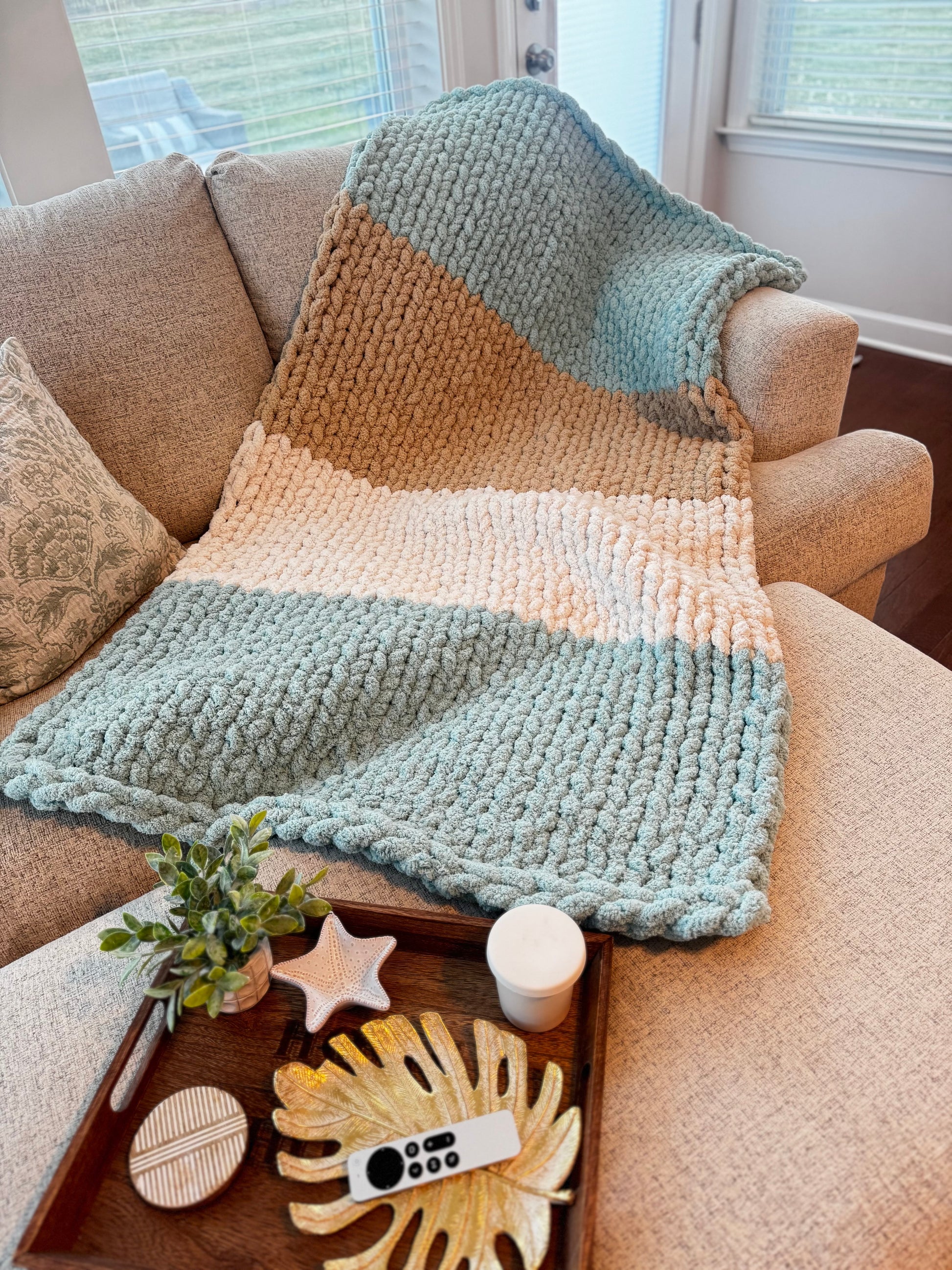Handmade chunky knit blanket adding cozy warmth to any space