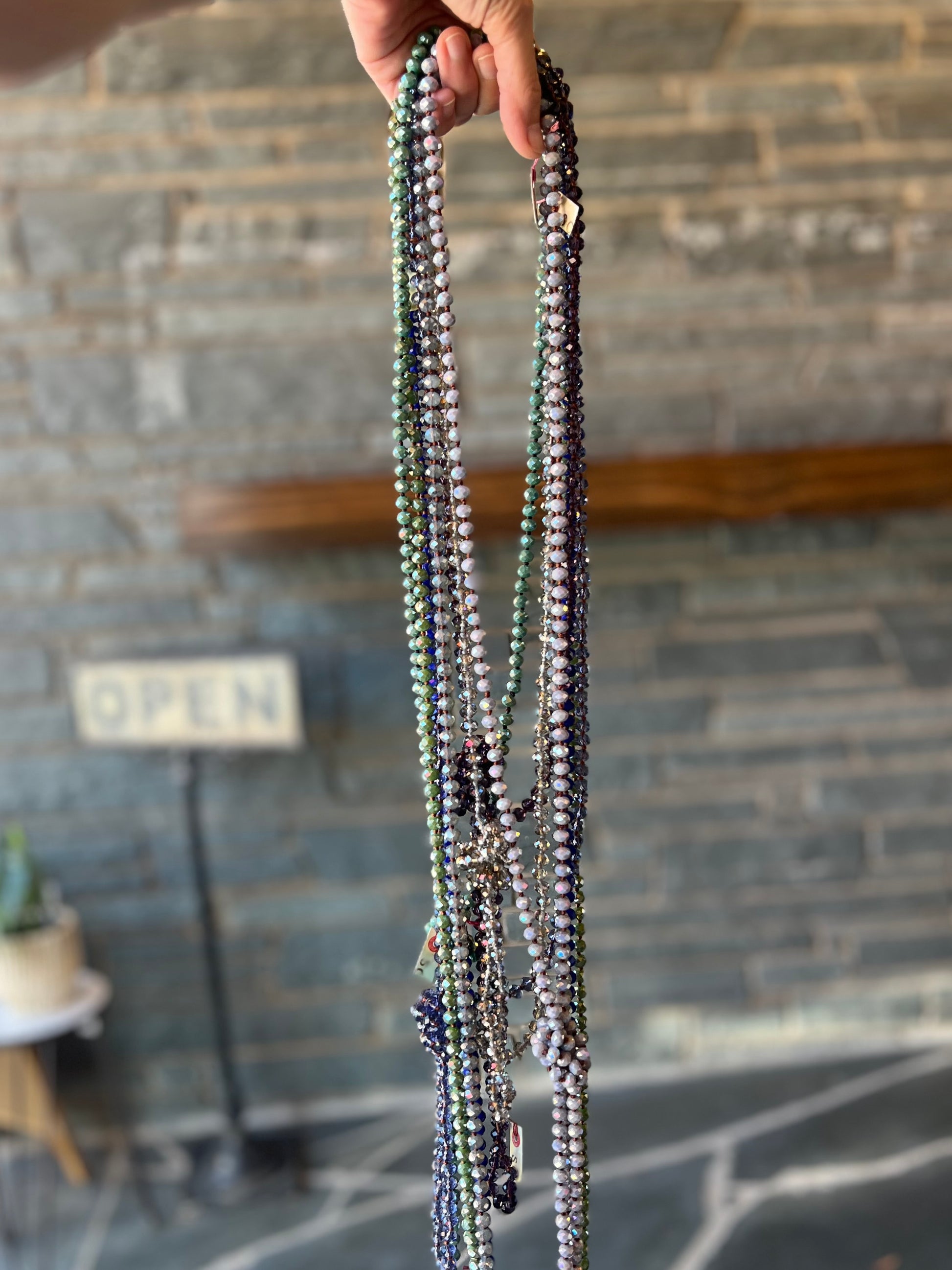Green rope necklace made with lightweight plastic beads