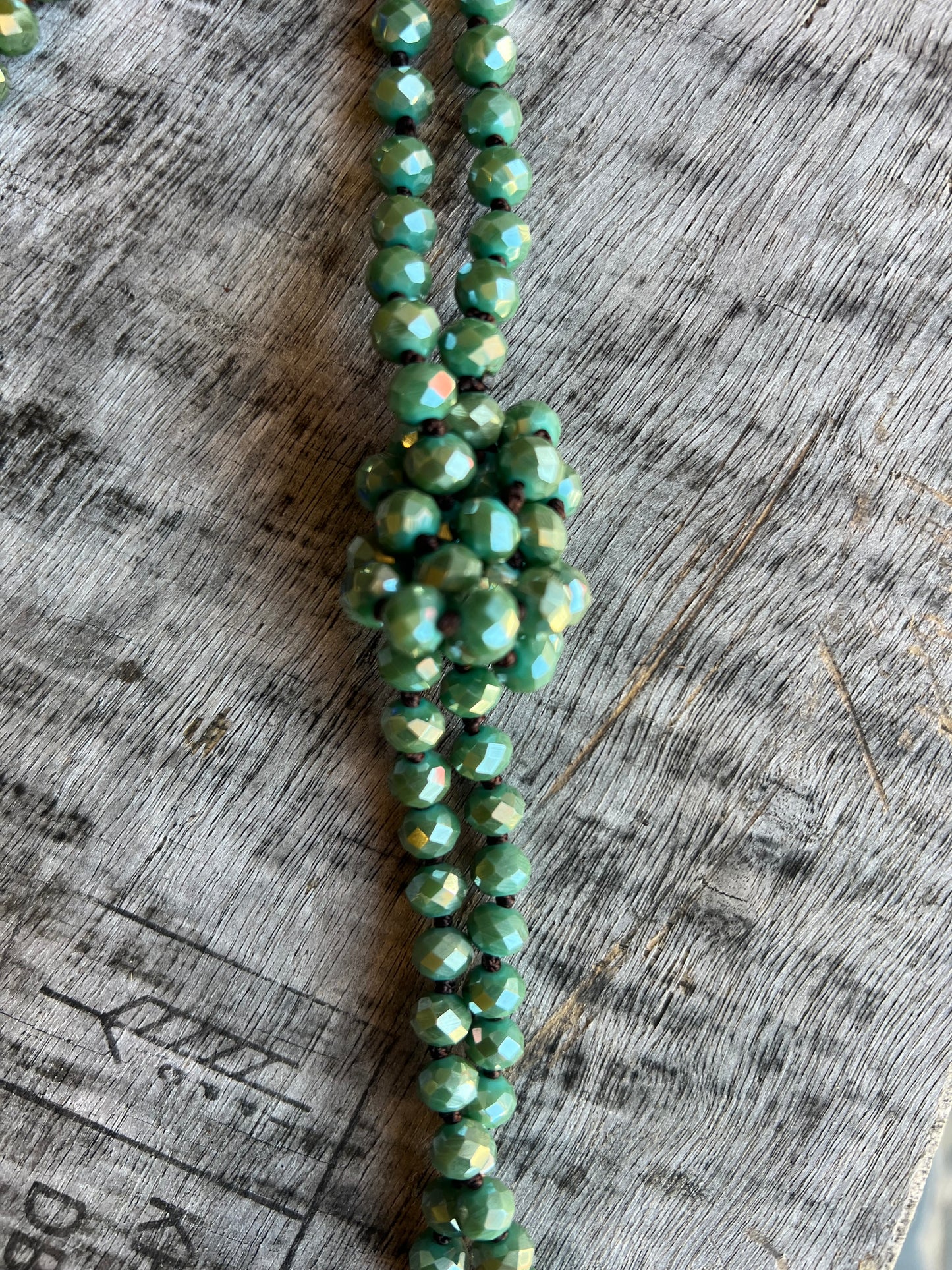 Long purple beaded rope necklace with knot detail