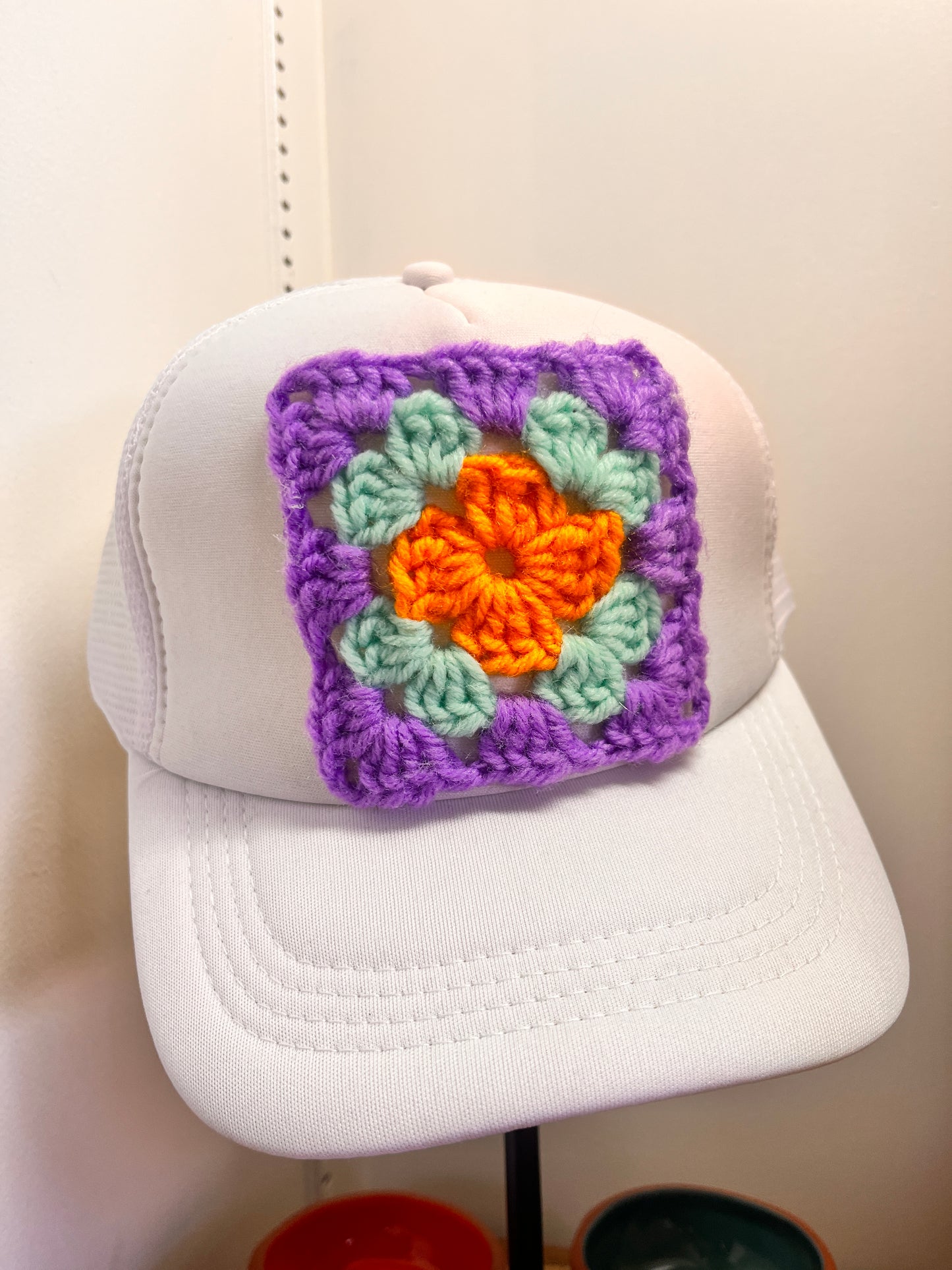 Handmade ball cap with colorful crochet granny square by Mama Bird Nest