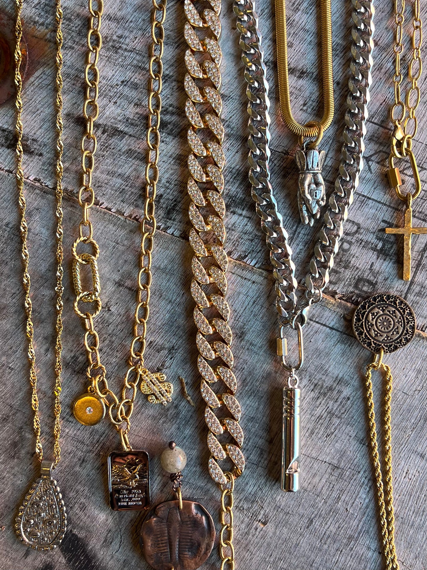 Layered necklaces with mixed pendants and chains