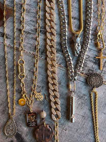 Layered necklaces with mixed pendants and chains