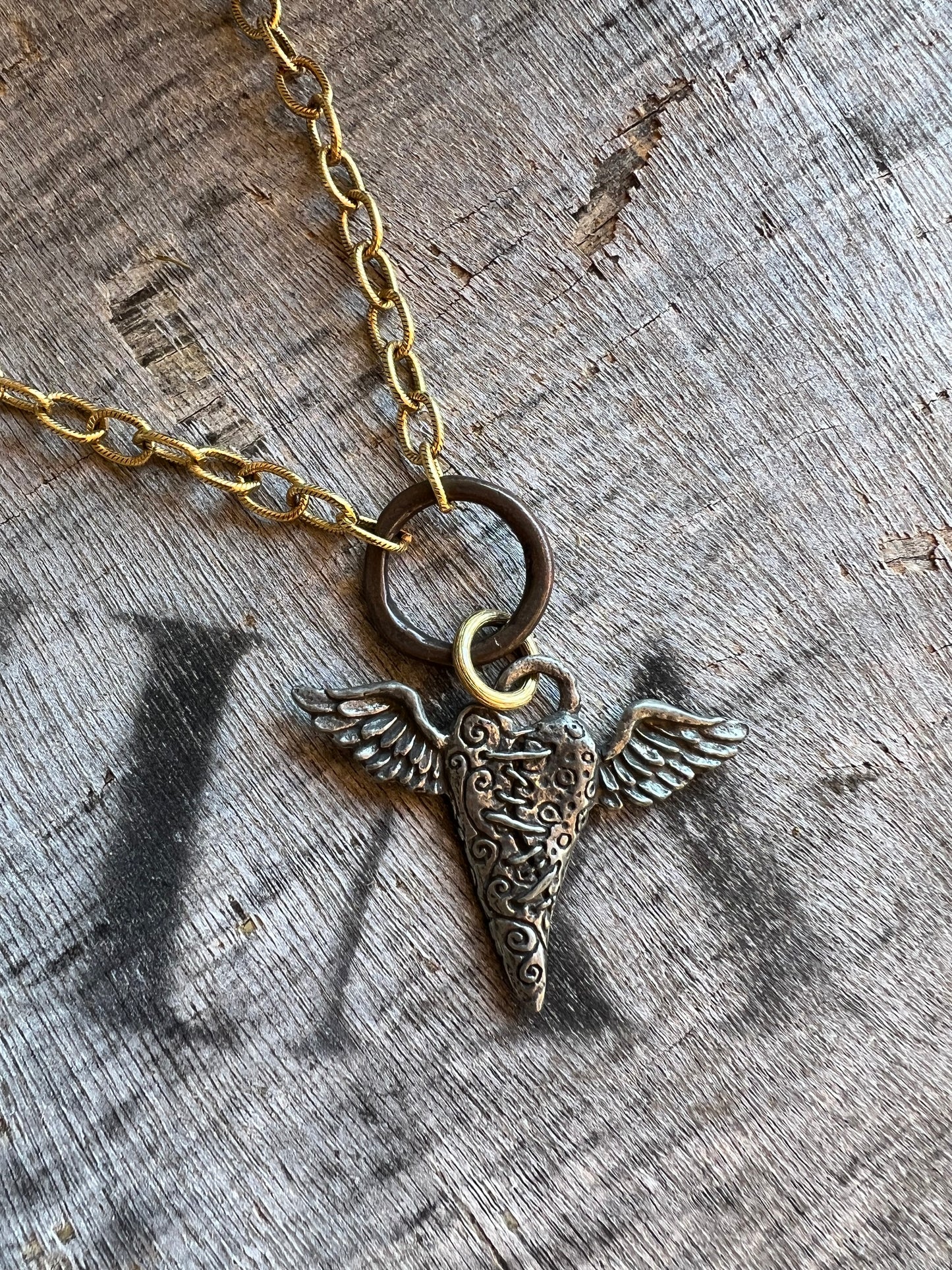 Antique style medallion necklace on gold chain