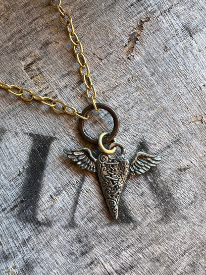 Antique style medallion necklace on gold chain