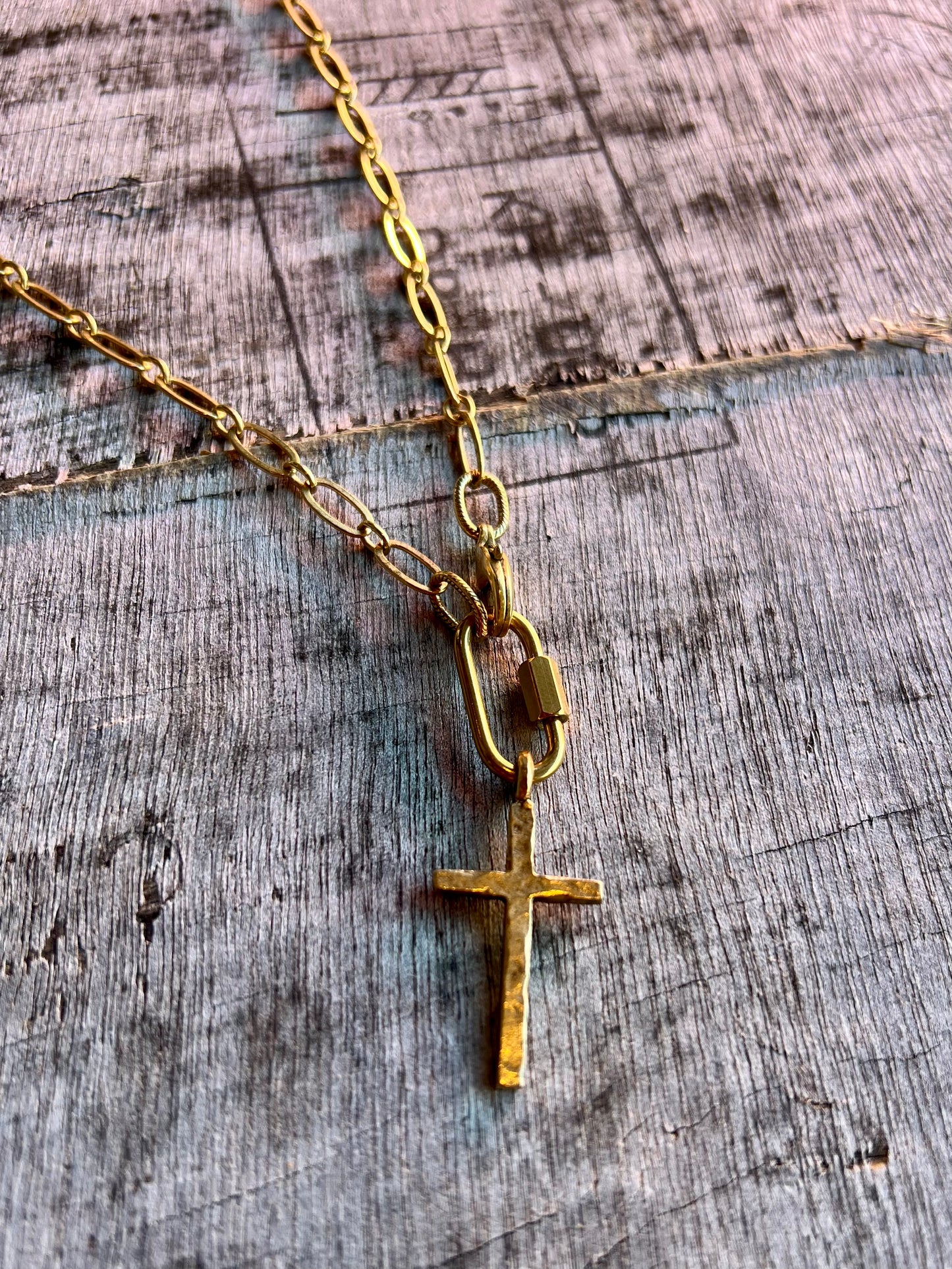 Gold cross pendant necklace on fine chain