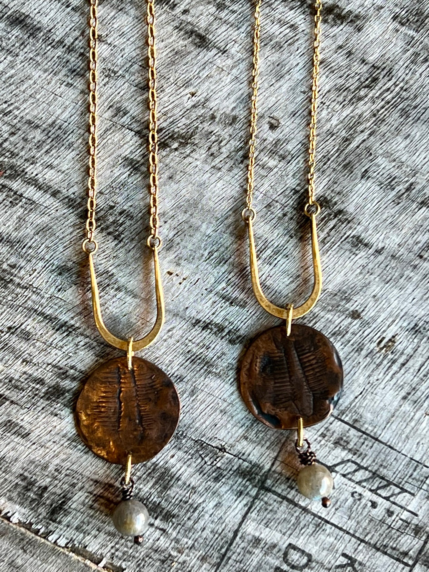Layered mixed metals necklace with boho charm