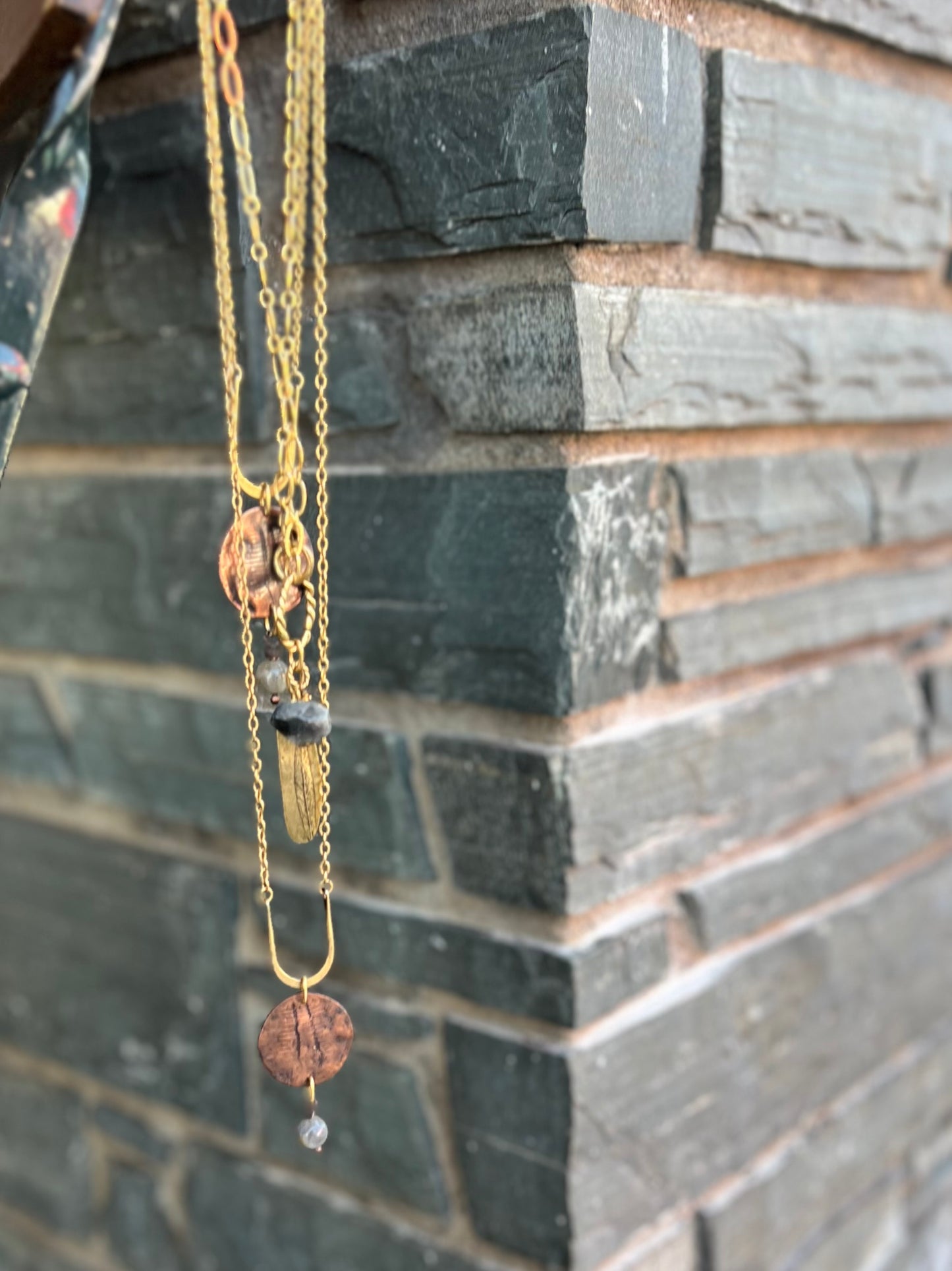 Handmade necklace with silver, brass, and copper tones