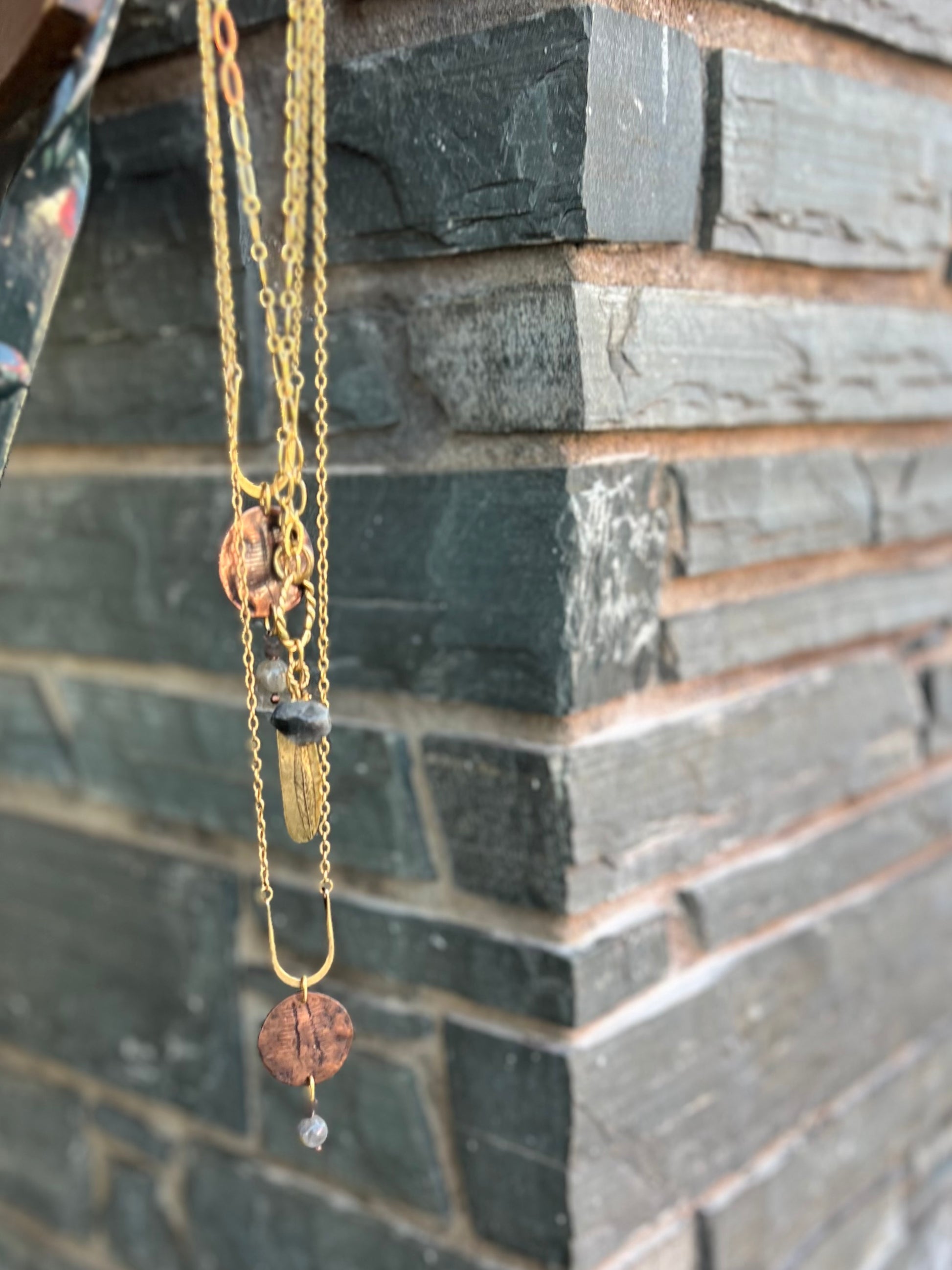 Handmade necklace with silver, brass, and copper tones