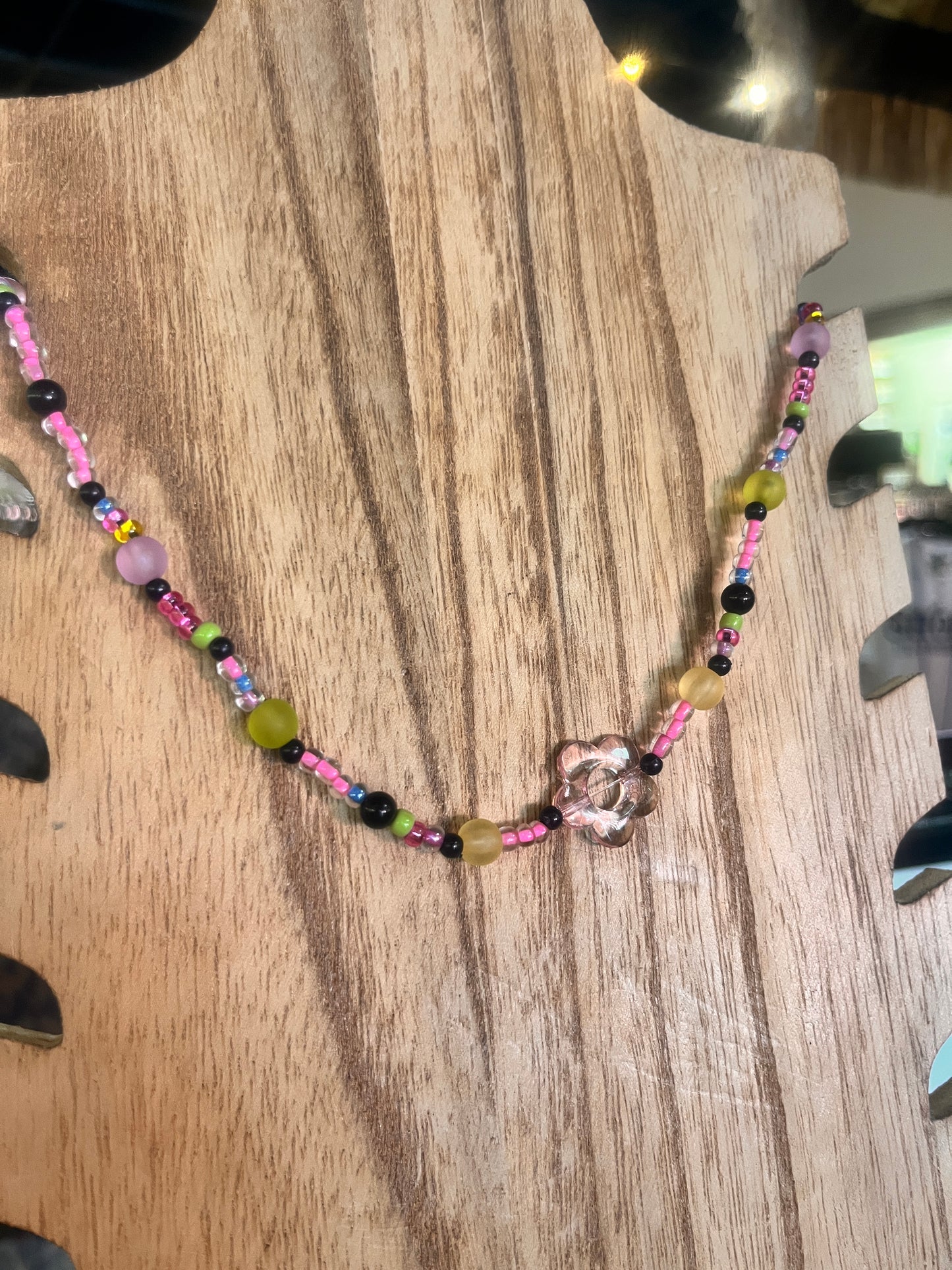 Artisan beaded necklace designed with creative color patterns