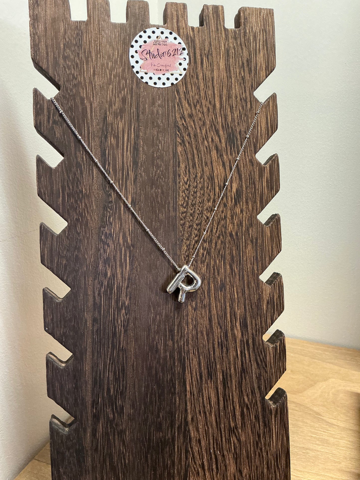 Studio 6212 handcrafted clay pendant necklace with artisan detail