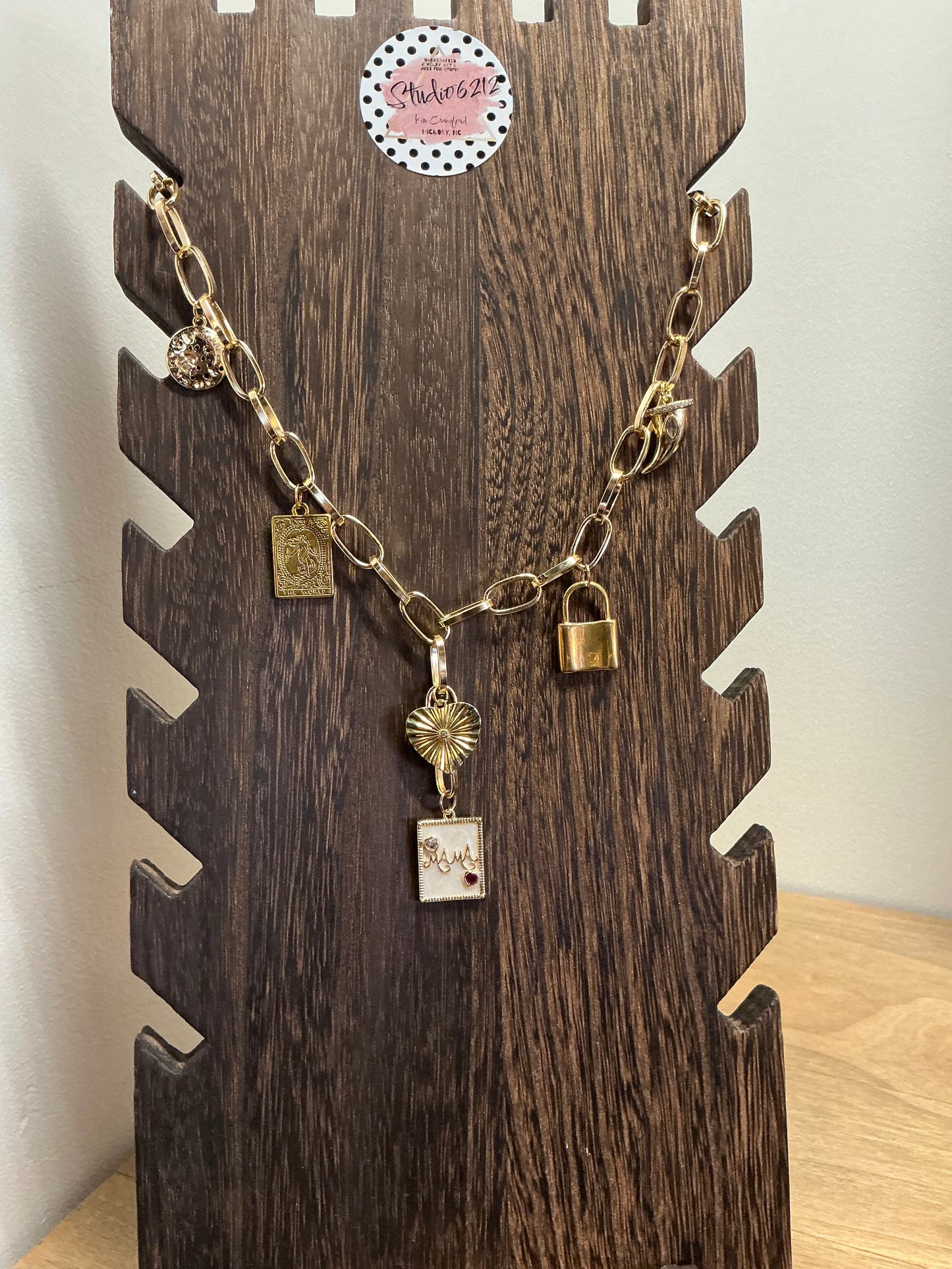 Studio 6212 artisan necklace featuring textured handcrafted charm