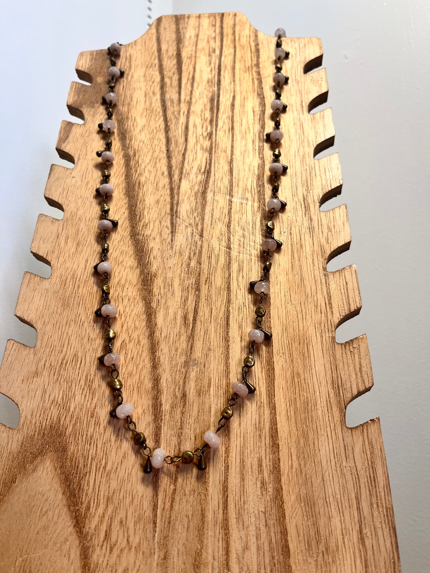 Handmade necklace featuring unique pendant and crafted details